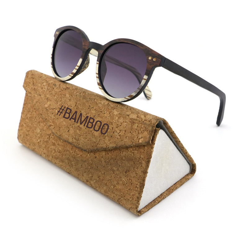 The AVELINE's round frames, crafted from ebony and white zebrawood, are perfect for small faces. Experience the elegance of a two-tone wooden frame while making a sustainable style statement.