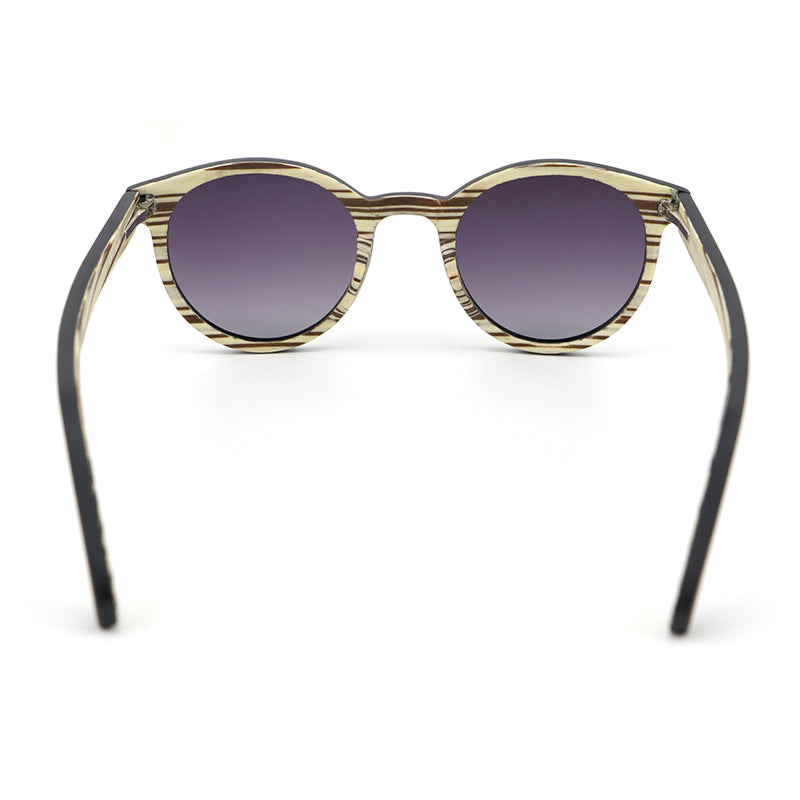 The AVELINE's round frames, crafted from ebony and white zebrawood, are perfect for small faces. Experience the elegance of a two-tone wooden frame while making a sustainable style statement.