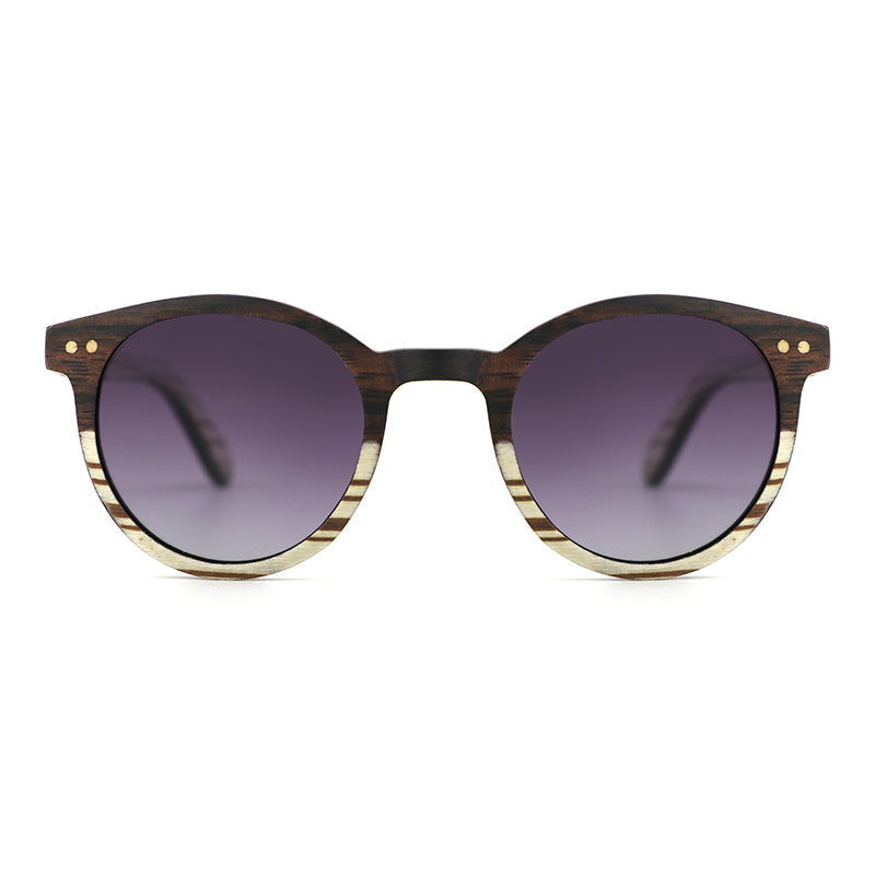 The AVELINE's round frames, crafted from ebony and white zebrawood, are perfect for small faces. Experience the elegance of a two-tone wooden frame while making a sustainable style statement.