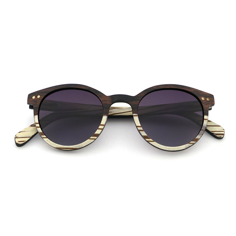 The AVELINE's round frames, crafted from ebony and white zebrawood, are perfect for small faces. Experience the elegance of a two-tone wooden frame while making a sustainable style statement.