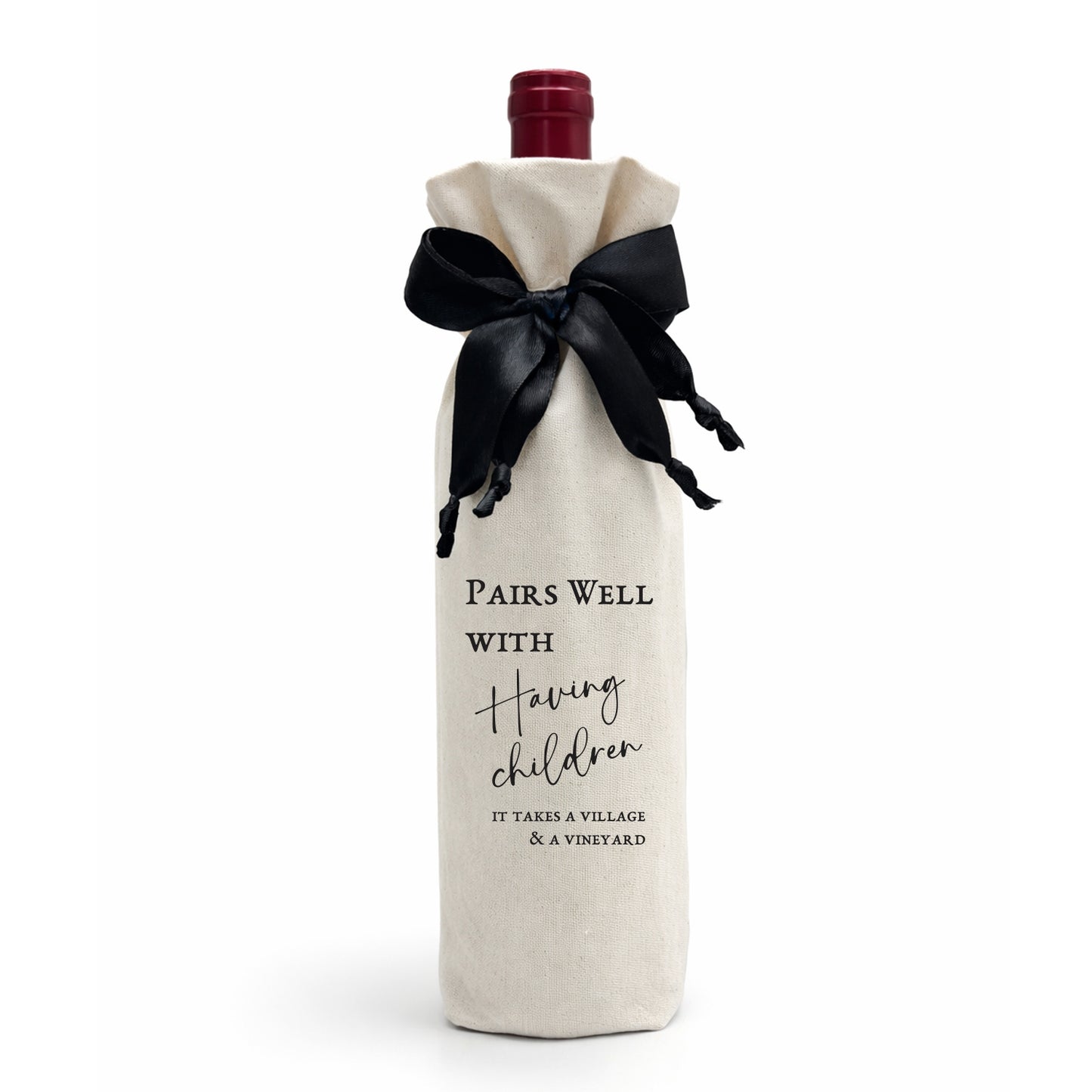 A luxury gift bag, made from calico cotton tied with a black satin bow. The bag reads: "Pairs Well with Having Children - it takes a village and a vineyard." Made in SA.