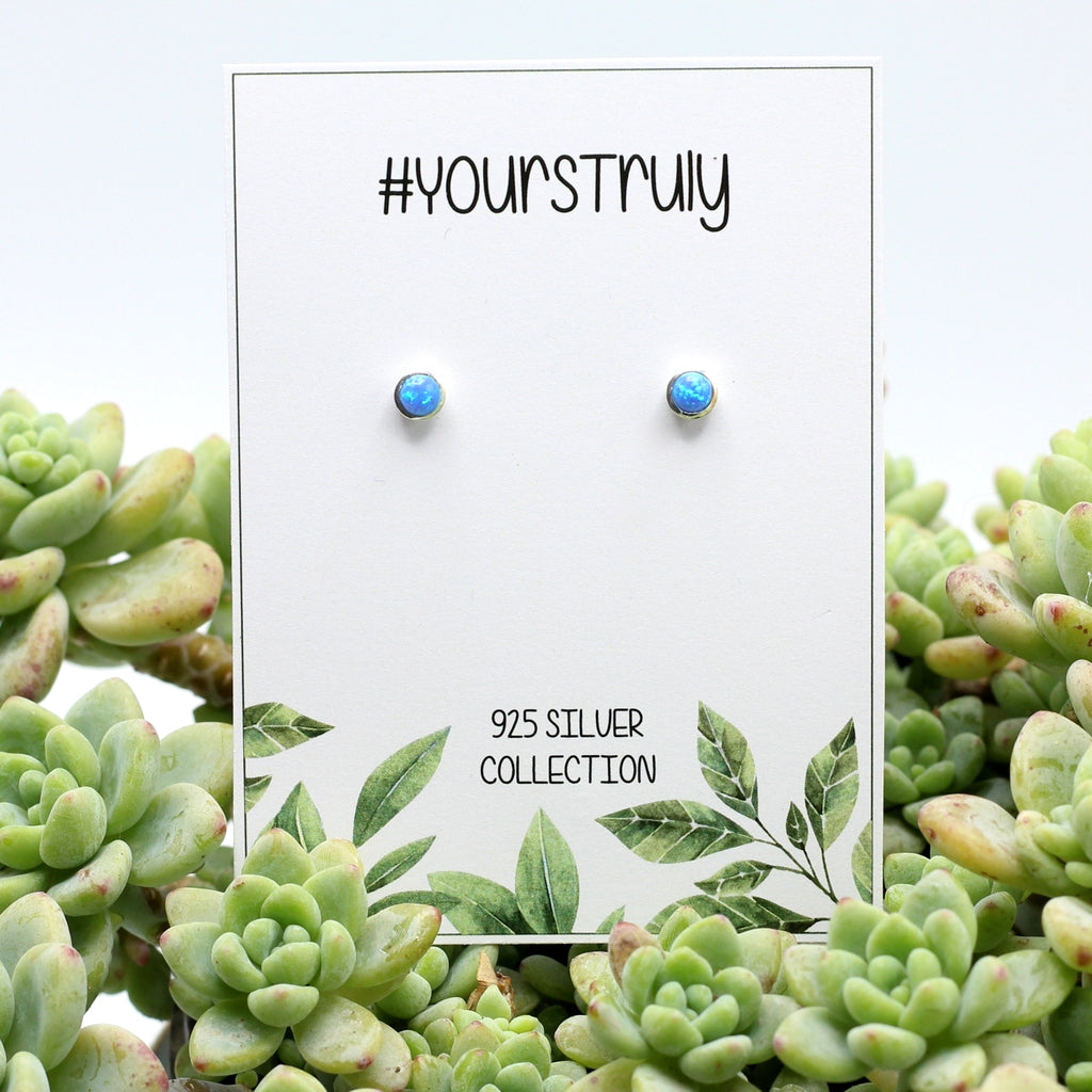 925 sterling silver earrings with deep sky blue opal. These are best earrings you will ever buy. So many happy customers. Delivery only R59 in SA.