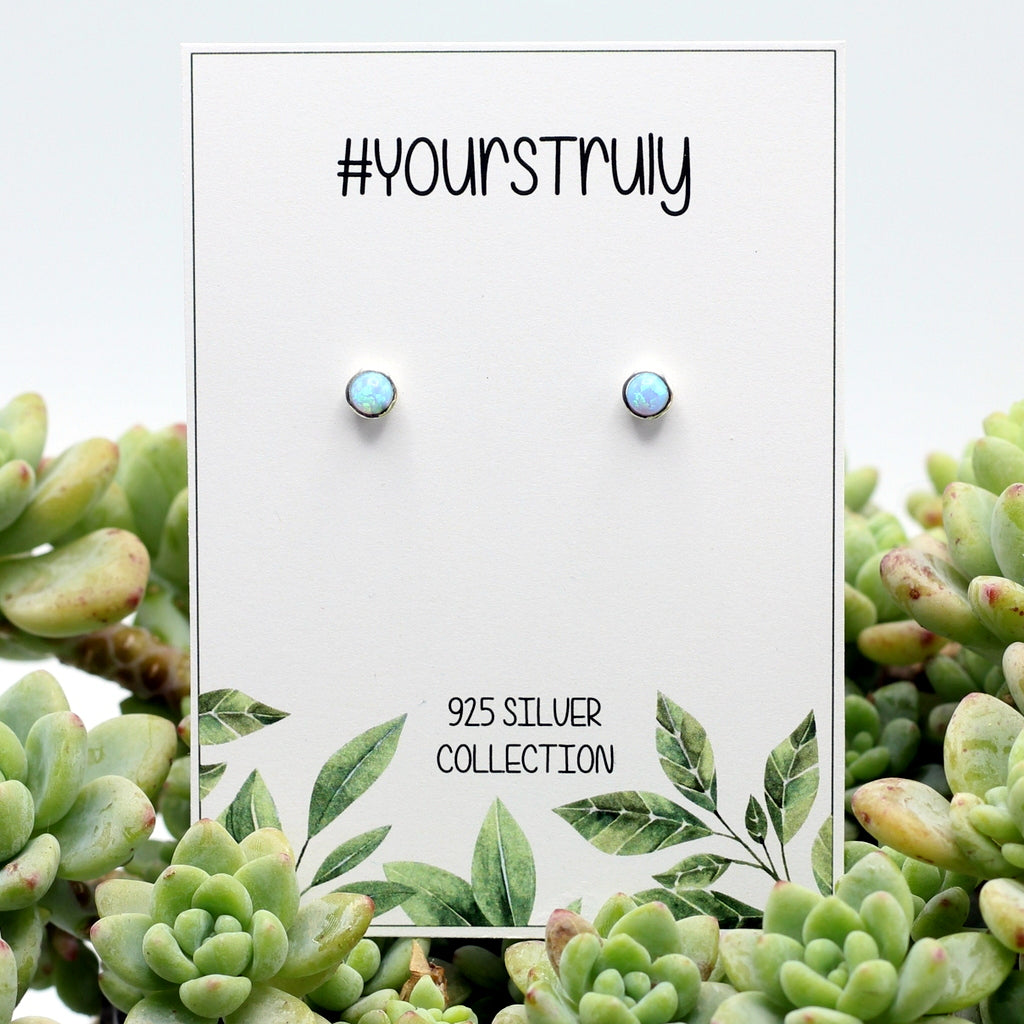 925 sterling silver earrings with deep sky blue opal. These are best earrings you will ever buy. So many happy customers. Delivery only R59 in SA.