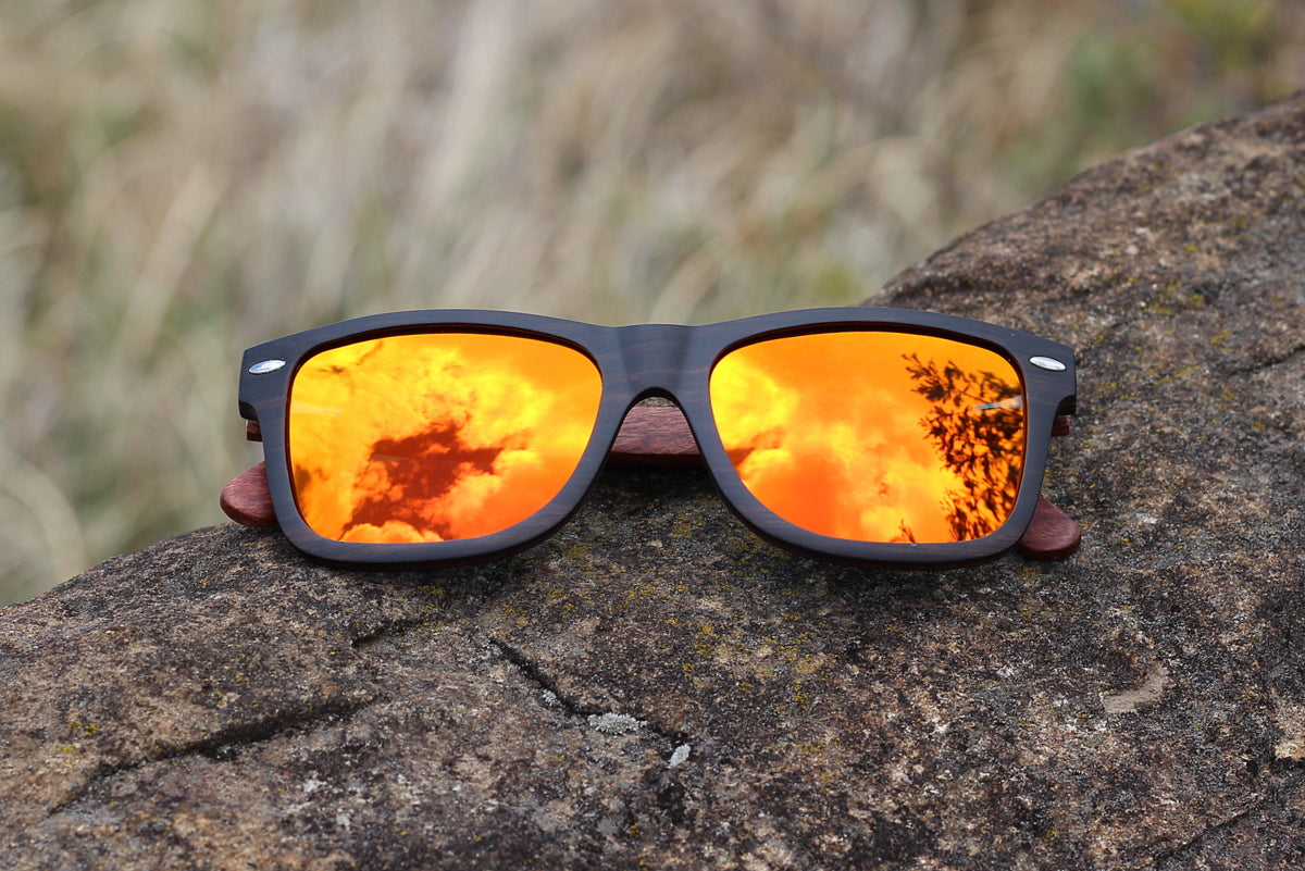 Mens solid wood ebony sunglasses with orange mirror polarised lens, includes free case valued at R120.