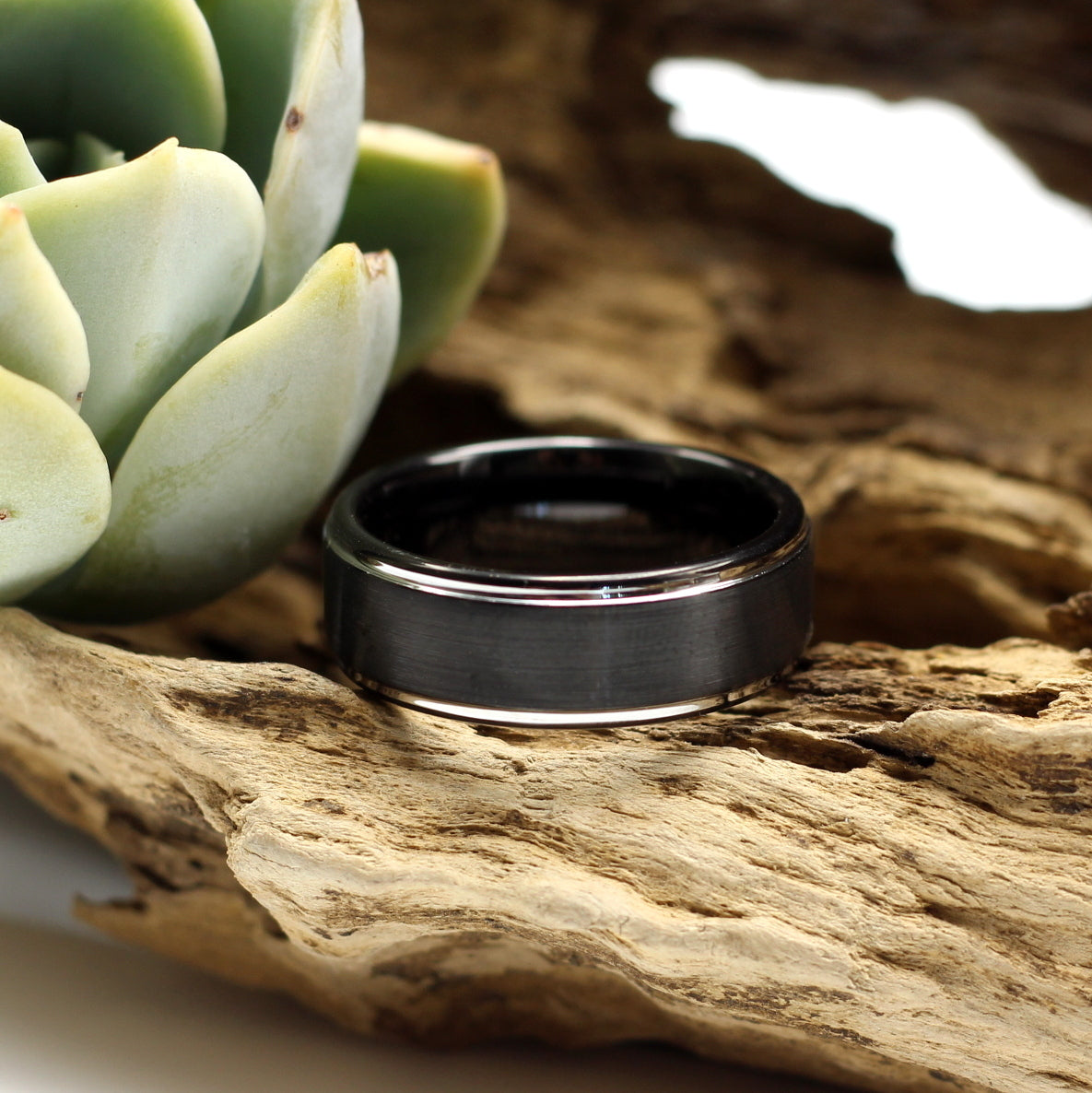 Men's black brushed tungsten ring 8mm wedding band with silver bevelled edges. Engrave a personalised message for only R80. Shipping anywhere in SA for R59.Men's black brushed tungsten ring 8mm wedding band with silver bevelled edges. Engrave a personalised message for only R80. Shipping anywhere in SA for R59.