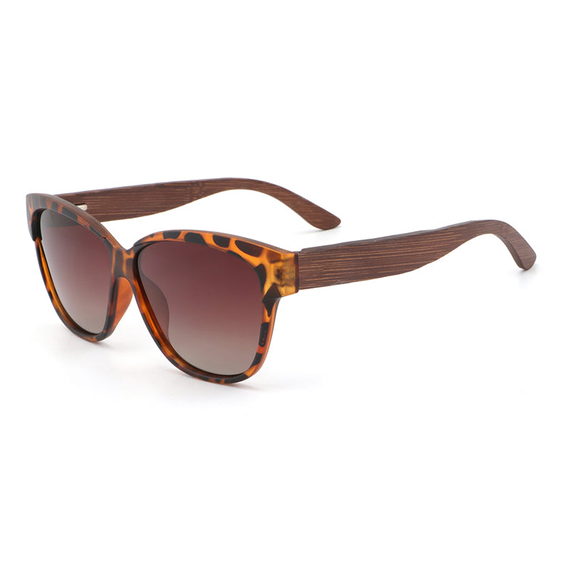 Hashtag Bamboo's NAOMI ladies sunglasses, featuring a slight cat-eye, tortoise-shell frame, polarized gradient brown lens and gorgeous hand-stained dark bamboo arms.