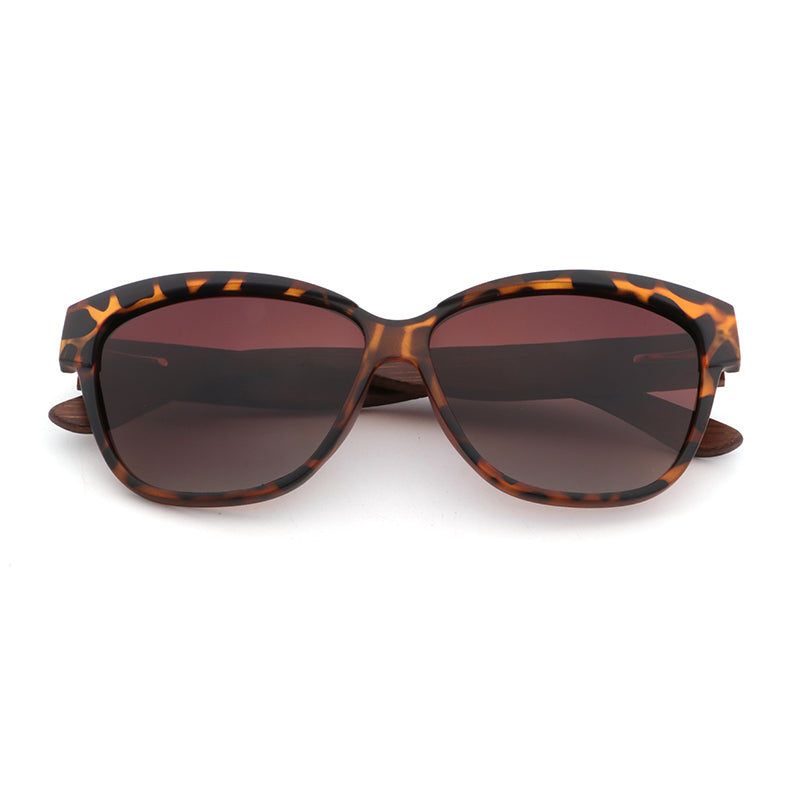 Hashtag Bamboo's NAOMI ladies sunglasses, featuring a slight cat-eye, tortoise-shell frame, polarized gradient brown lens and gorgeous hand-stained dark bamboo arms.