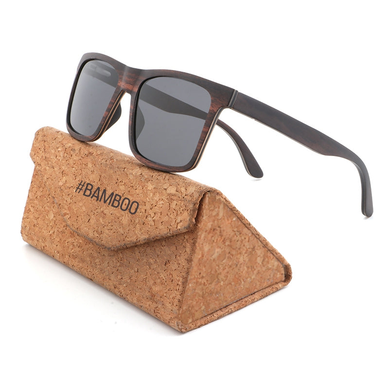 Linden men's brown wooden sunglasses with dark grey polarised lenses on a Hashtag Bamboo branded cork case.