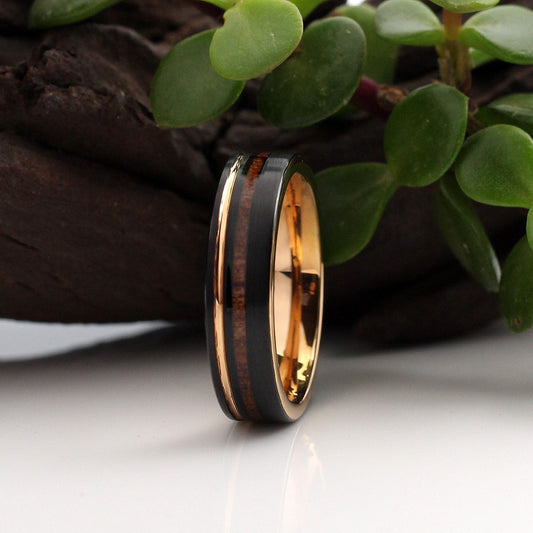 Men's black tungsten 6mm ring with wood inlay and rose gold band. Hashtag Bamboo, orbit rings, NYJ we've got them covered.
