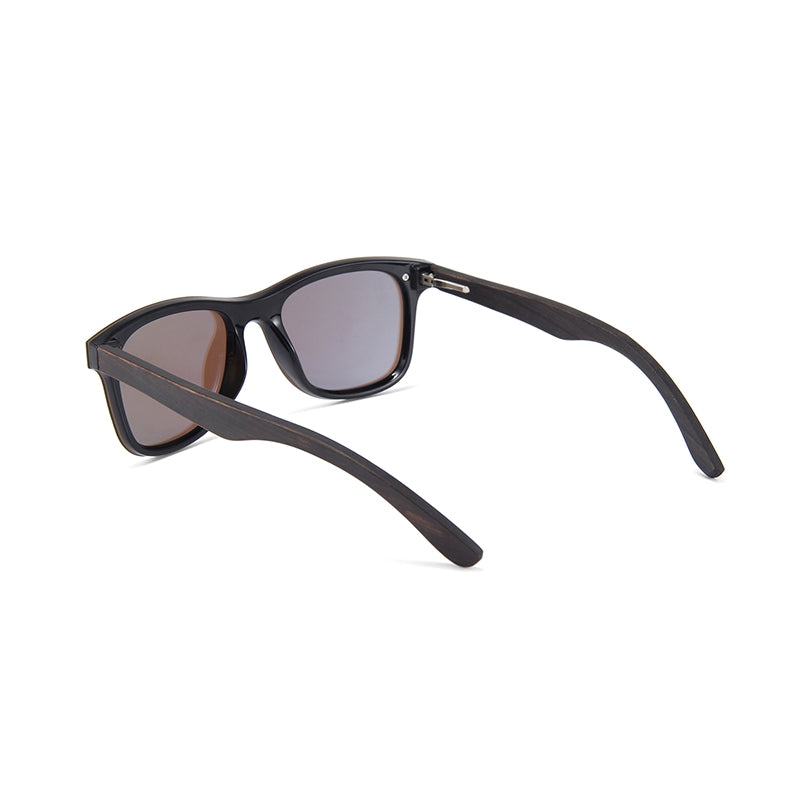 Black acetate sunglasses with brown tinted lenses, shown from a three-quarters angle on a white background.