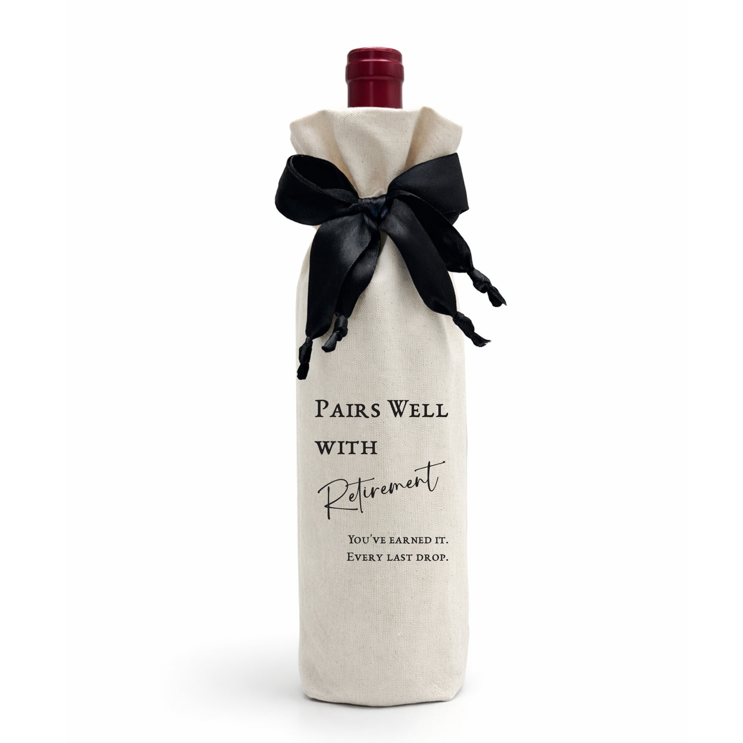 A luxury gift bag, made from calico cotton tied with a black satin bow. The bag reads: "Pairs Well with Your 60th — You've earned it. Every last drop. Made in SA.