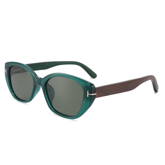 Cat-eye sunglasses with a translucent green acetate frame, dark gray lenses, and dark brown wooden temple arms, shown on a plain white background.