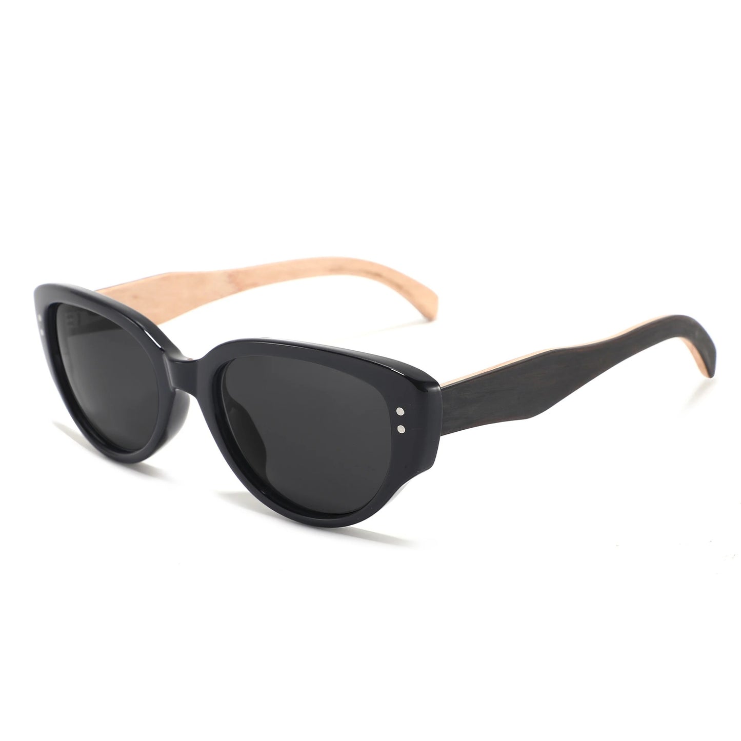 Oversized cat-eye sunglasses with a glossy black frame and dark lenses, featuring light natural wood temples with small silver rivets.