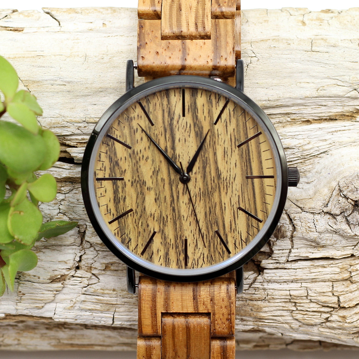 Men's modern stainless steel watch with zebra wood face and wooden strap. Thin, lightweight , eco-friendly and uber-trendy. Engrave a message on the back for R80. Shipping anywhere in SA for R59.