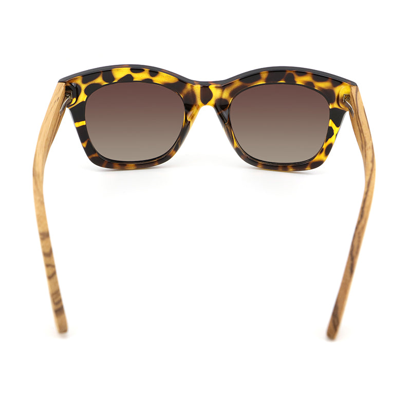 The Khloe Yellow TS frame with gradient brown polarized lens and zebrawood arms, exclusive to Hashtag Bamboo.