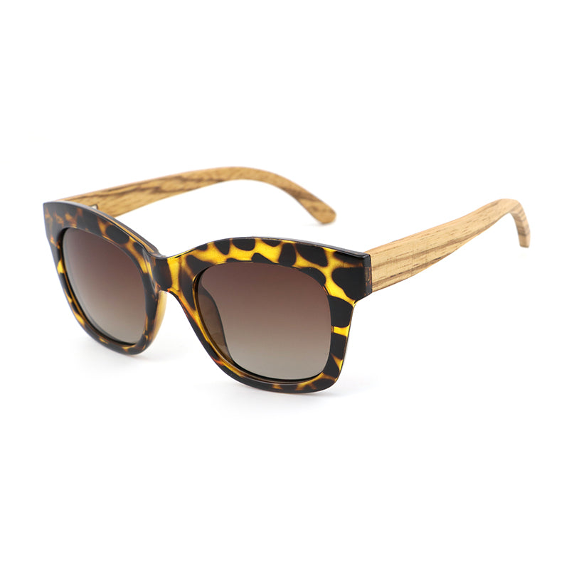 The Khloe Yellow TS frame with gradient brown polarized lens and zebrawood arms, exclusive to Hashtag Bamboo.