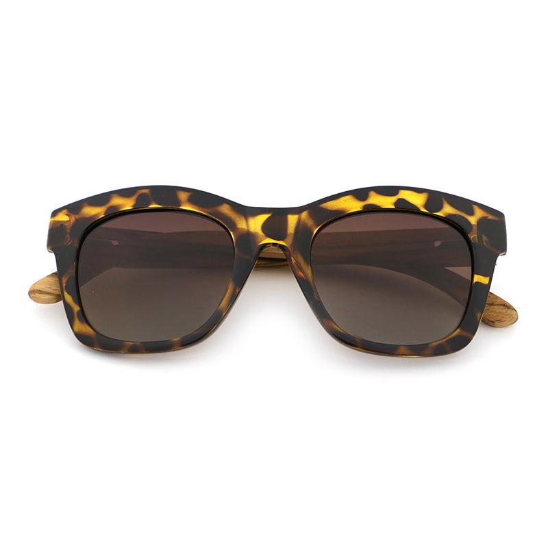 The Khloe Yellow TS frame with gradient brown polarized lens and zebrawood arms, exclusive to Hashtag Bamboo.