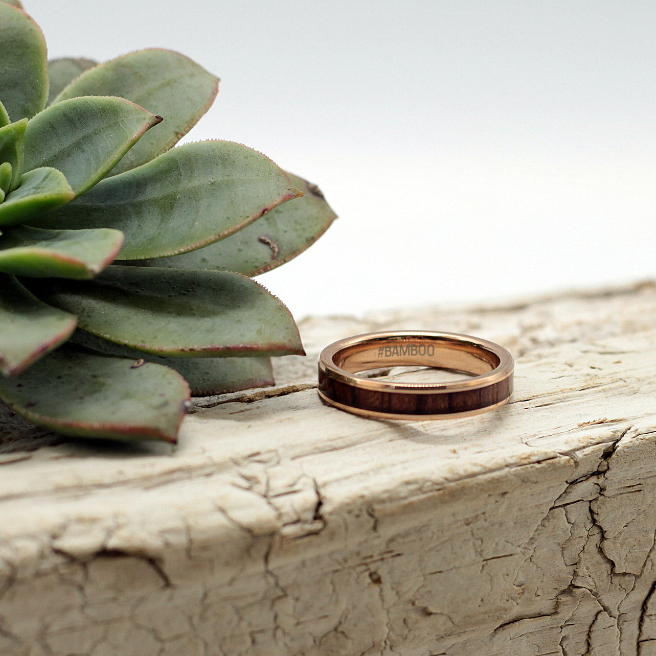 Ladies rose gold tungsten ring with koa wood inlay, 4mm band, matching men's ring available, Hashtag Bamboo, orbit rings.