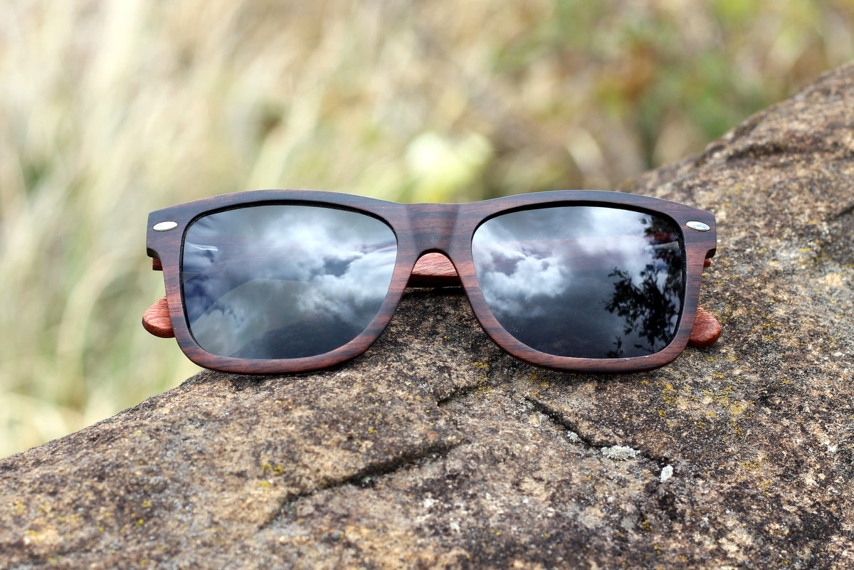 Mens solid wood ebony sunglasses with grey polarised lens, includes free case valued at R120. 