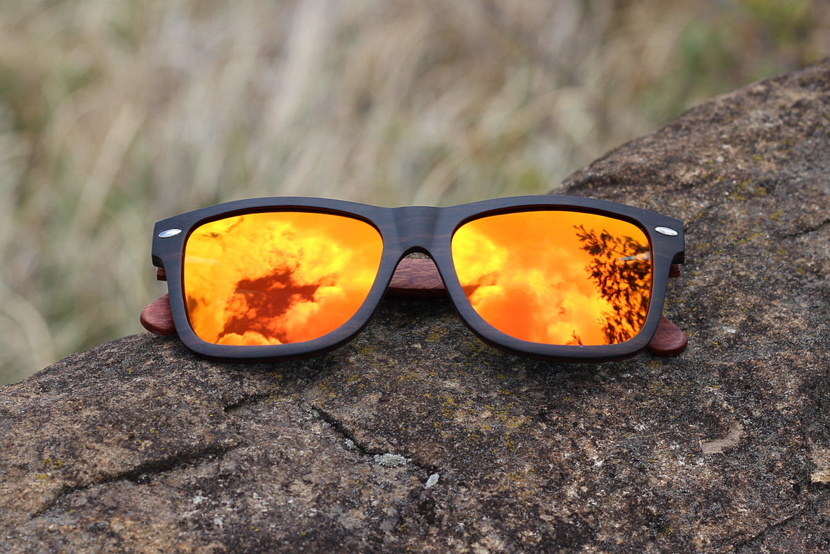 Mens solid wood ebony sunglasses with orange mirror polarised lens, includes free case valued at R120. 