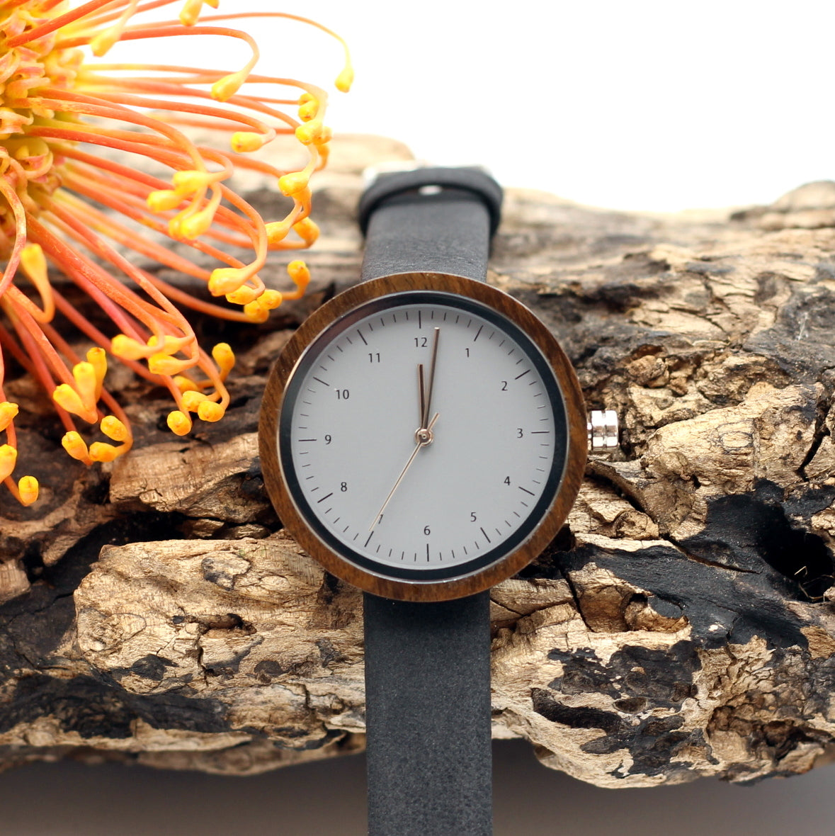 Kanso CUTIE Round Petite Wooden Watch ebony wood with vegan leather black strap, make it personal and engrave a message on the back. Shipping only R59.