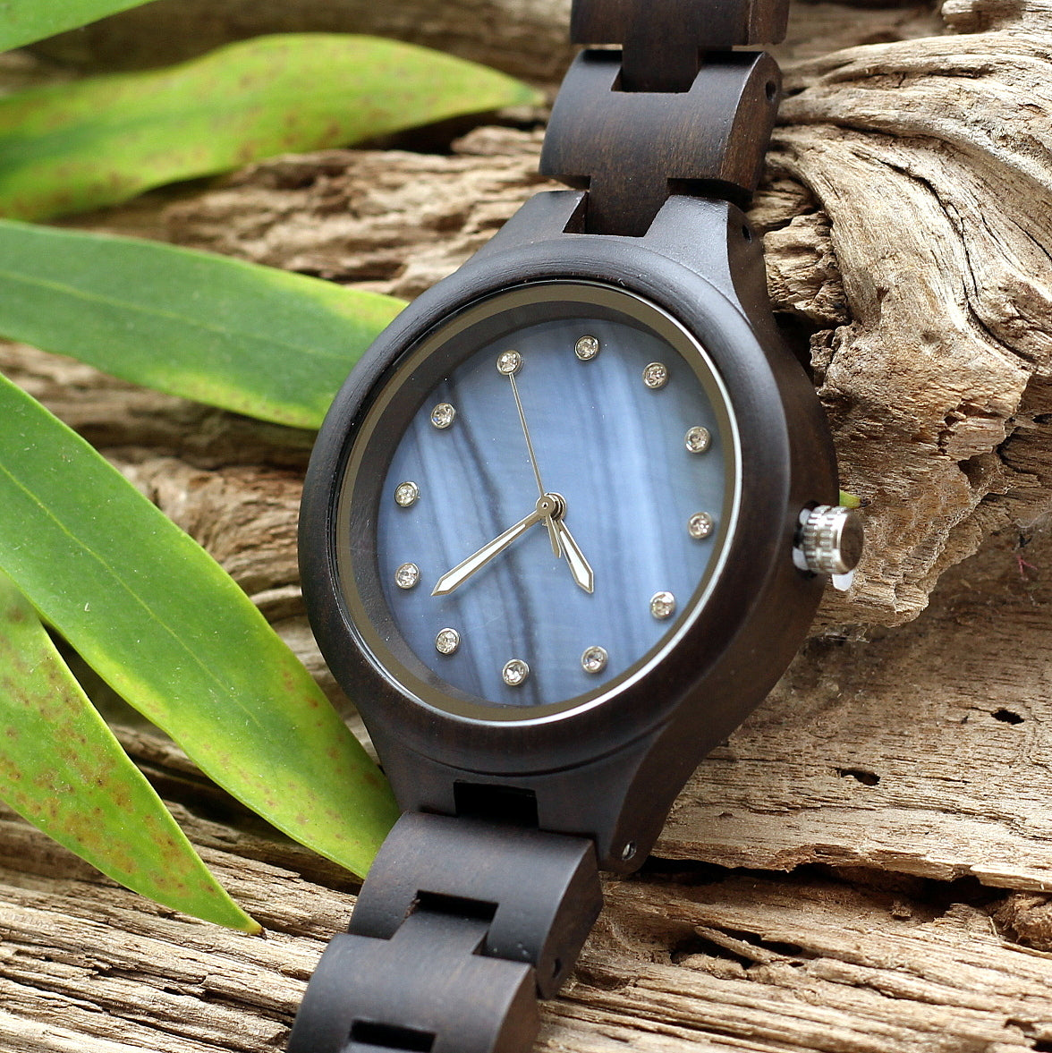 Ladies Wooden watch ebony wood with blue mother of pearl face and diamante watch face. Solid wooden strap with engraving option on the back.