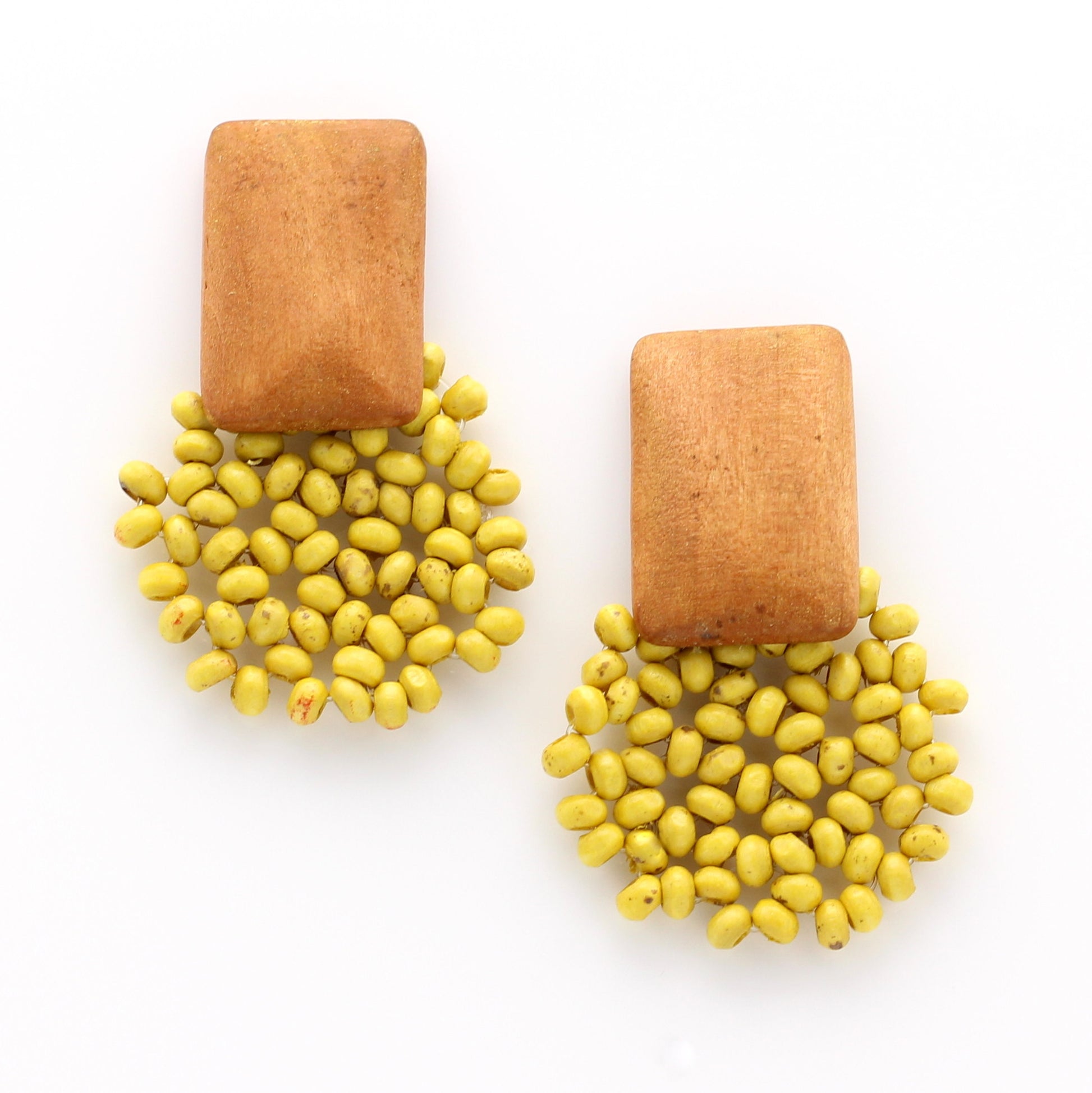 Handmade wooden bead earrings in ochre.