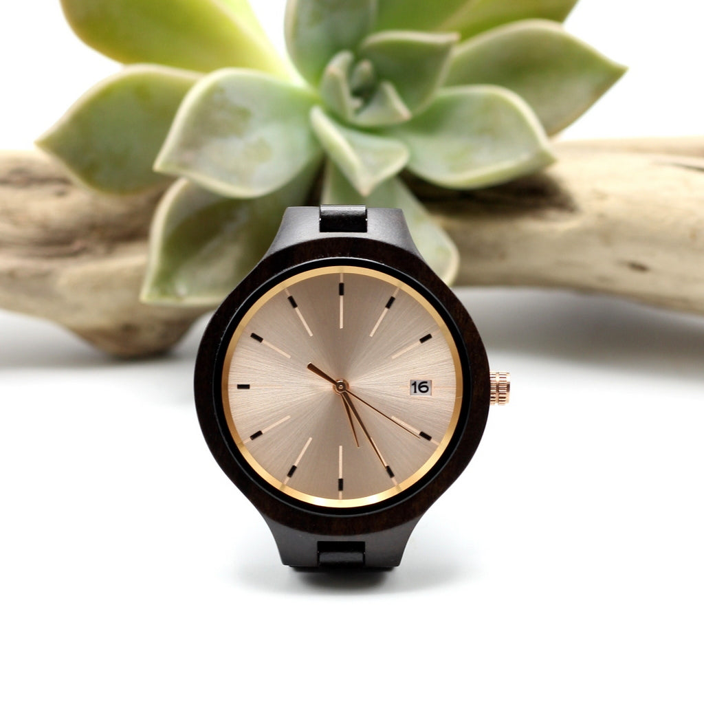 Ladies ebony wooden watch with solid wood strap, rose gold face with date function. Engrave a message on the back for R100.