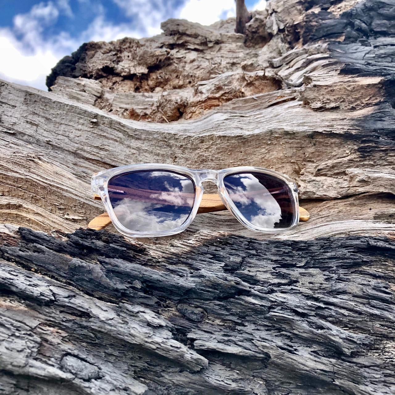 Ladies clear frame sunglasses with grey lens and zebra wood arms. Polarised and UV protection for our South African sunny skies. Hashtag Bamboo, local is lekka.